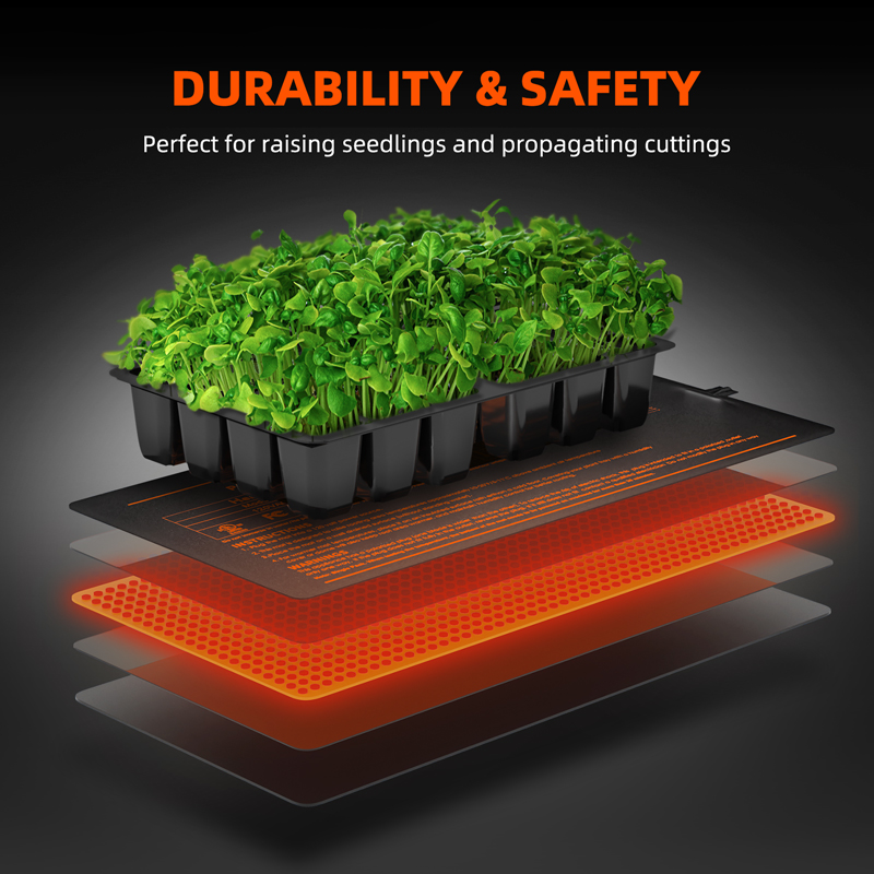 Seed starter tray sitting on a seedling heat mat